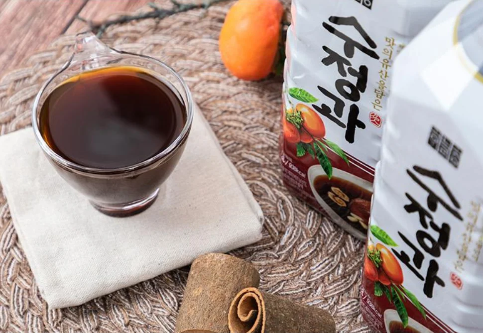 
Sweet sujeonggwa drink Korean traditional cinnamon punch beverage made with 100% domestic nut and malt syrup 