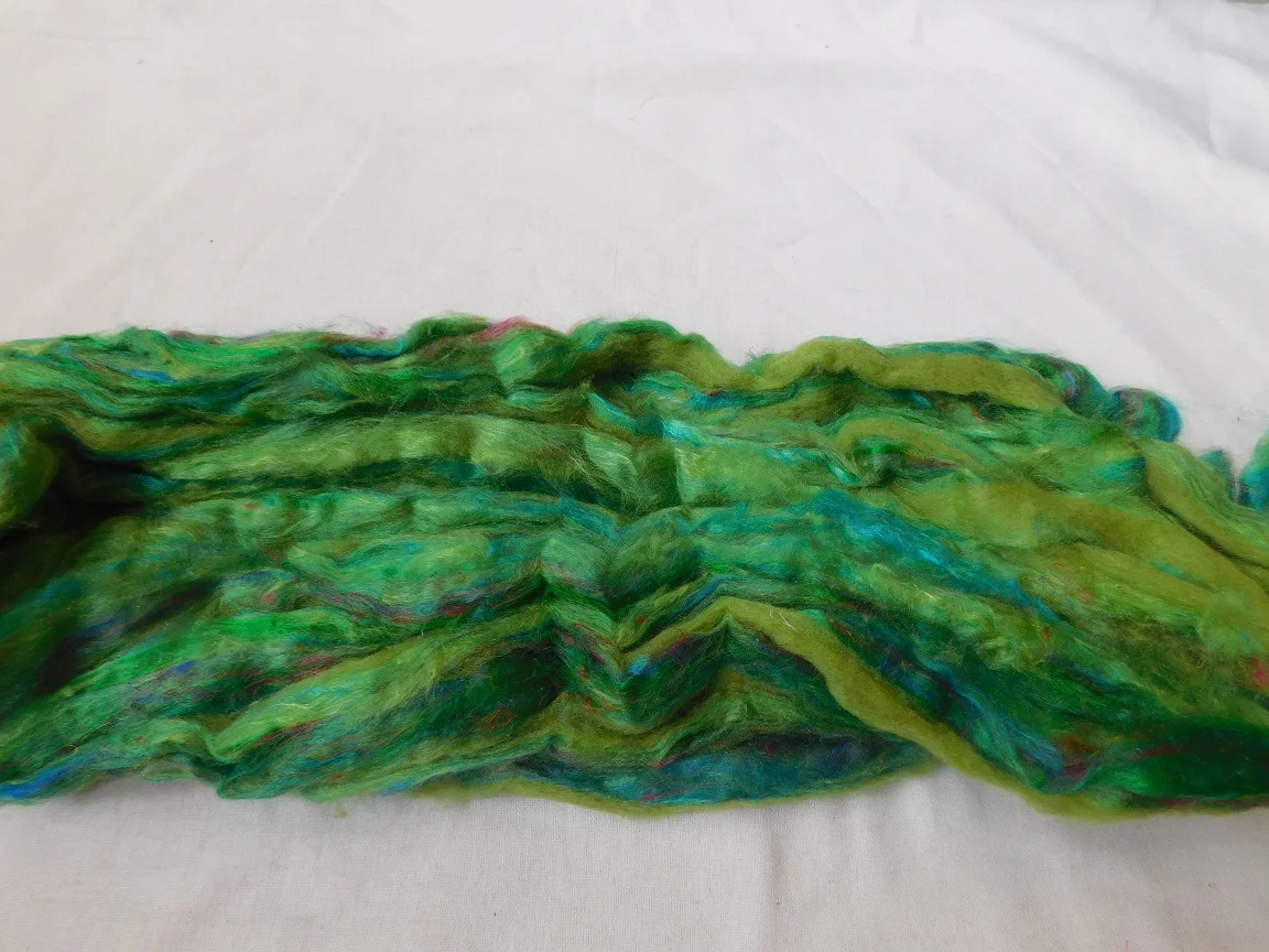 sari silk roving in two tone custom dyed colors suitable for yarn and fiber stores made from recycled silk fiber