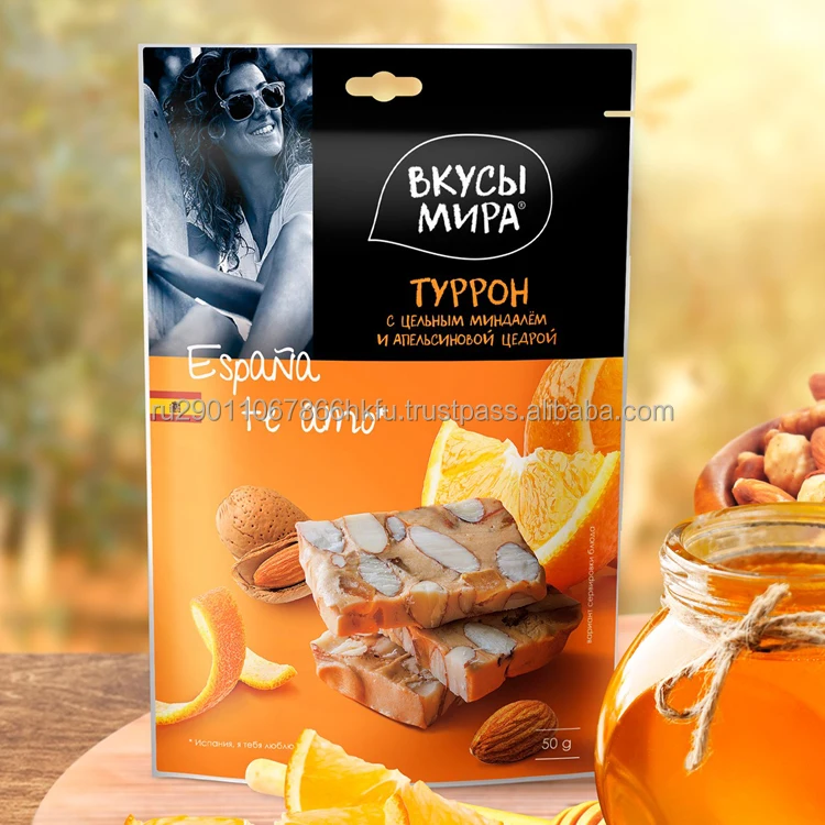 Вкусная здоровая закуска нуга с жареным миндалем и апельсиновой цедью много аскорбиновой кислоты витамина А