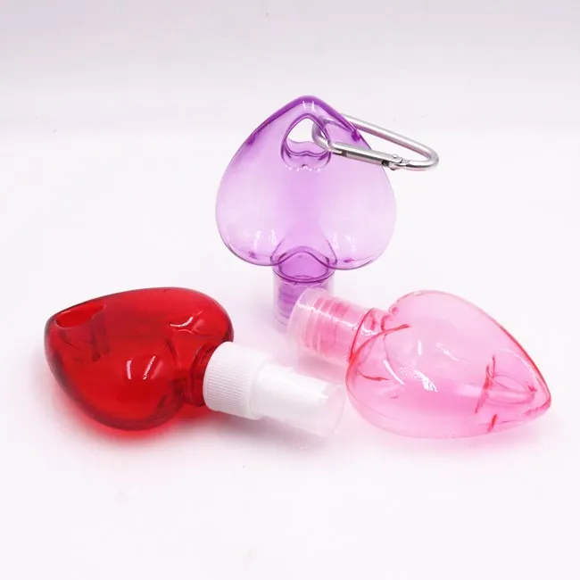 wholesale 50ml empty heart shape plastic PETG HDPE hanging hand sanitizer spray bottle with hook keychain bottles