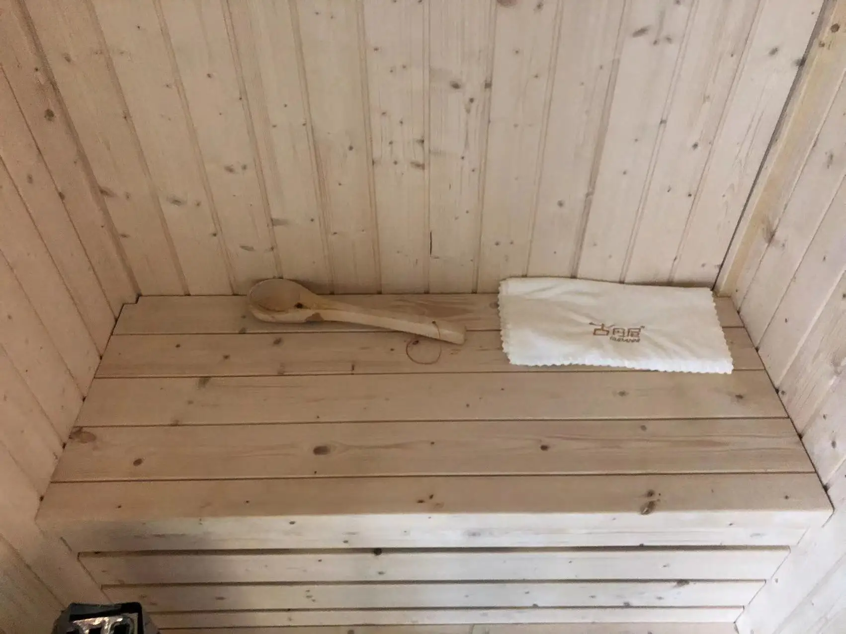 white spruce stone stove sauna room