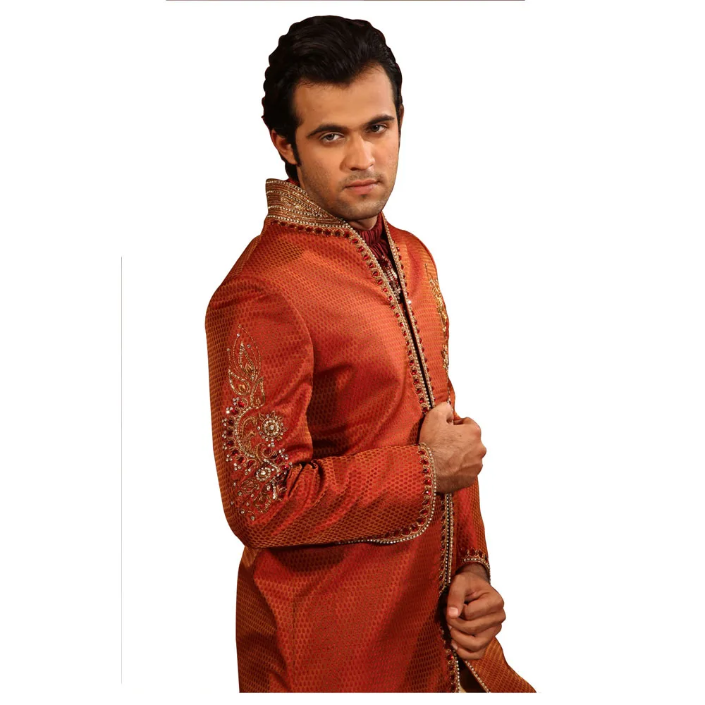 
Stylish Highneck Indian Wedding Rust Sherwani Kurta Pajama For Men Consummate Charm Of Kela Brocade Fabric With A Stylish V Neck 
