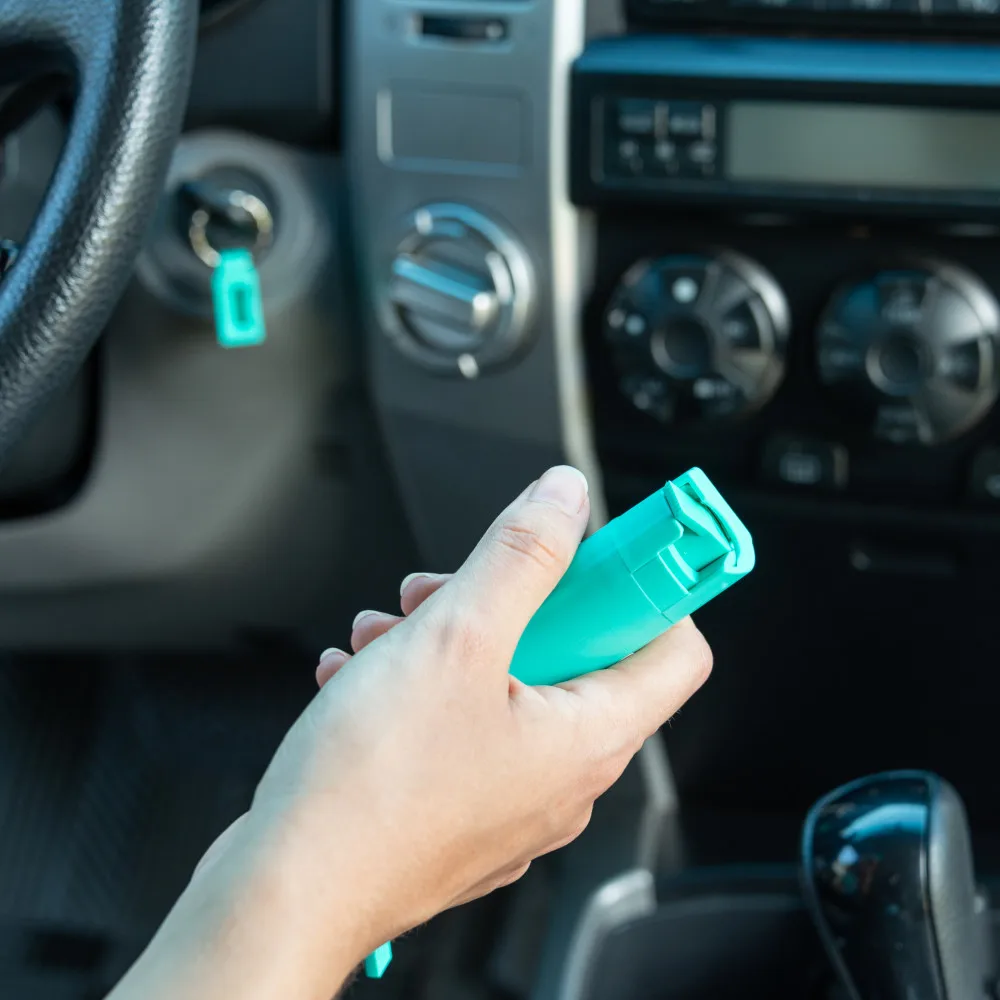 SABRE Pepper Spray With Quick Release Key Ring, 25 Bursts, 10 Foot (3 Meter) Range, Mint Green