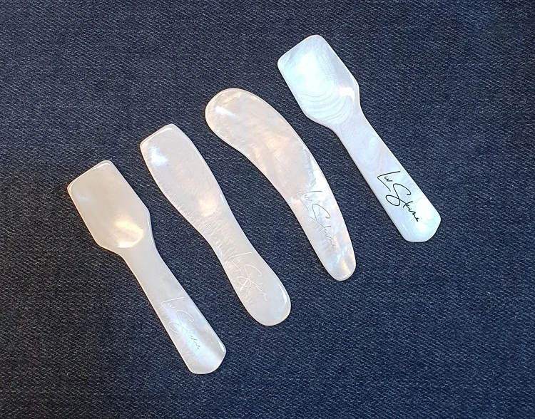 A collection of pretty little spoons made from white pearls for cosmetic use or  tasting caviar provided by Vietcrafts