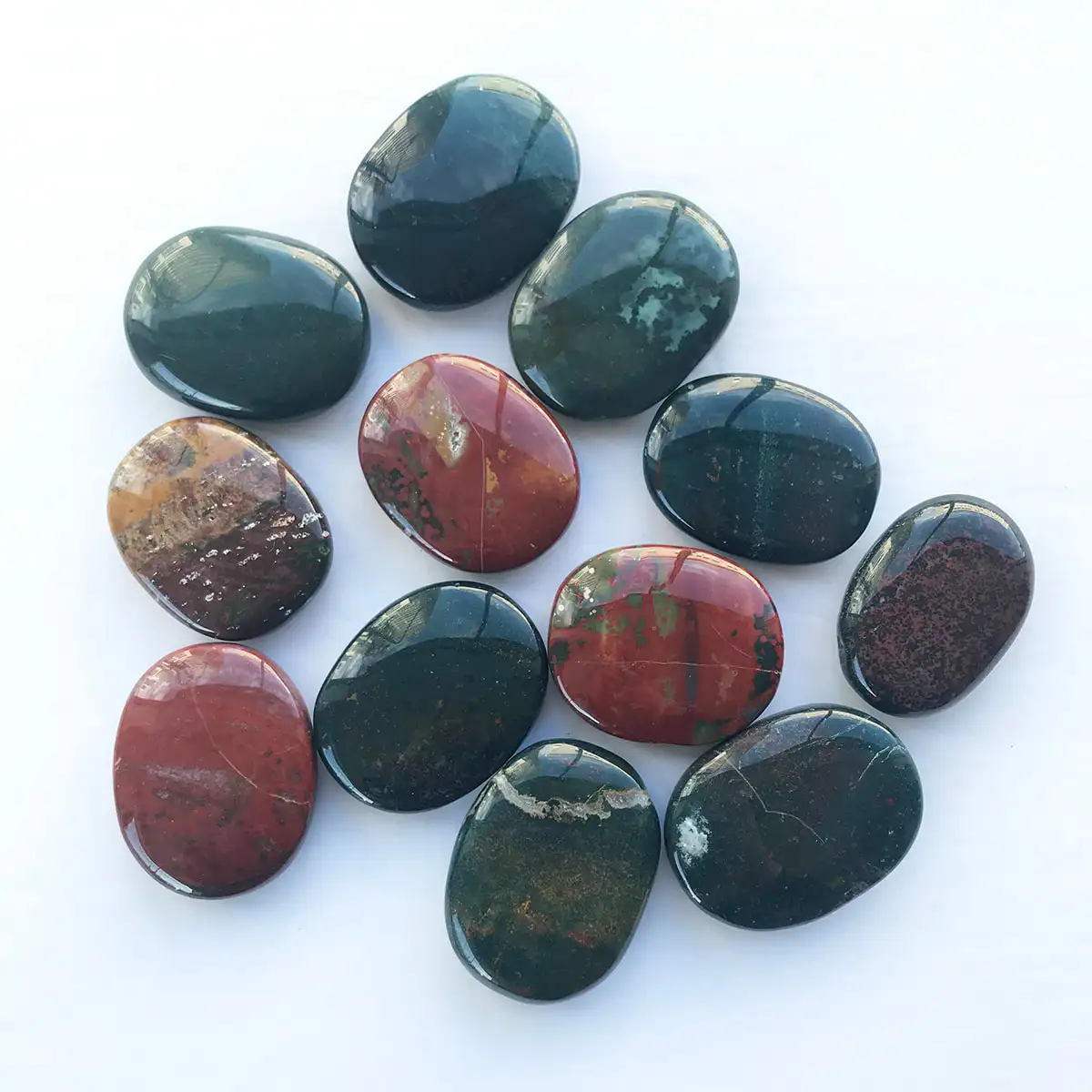 Premium quality red blood stone palm stones for healing crystals and worry stone .