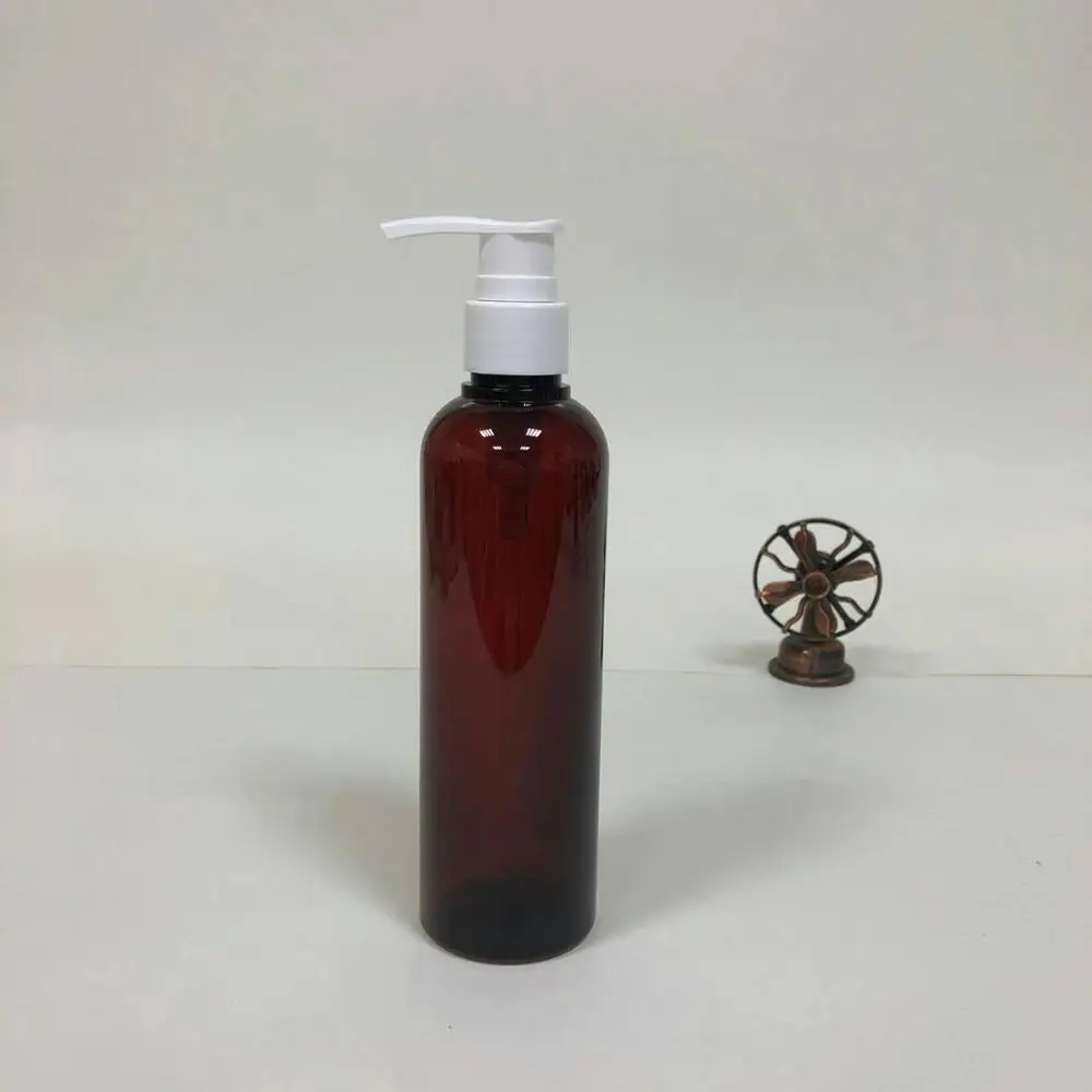 amber plastic PETG round bottle with white pump