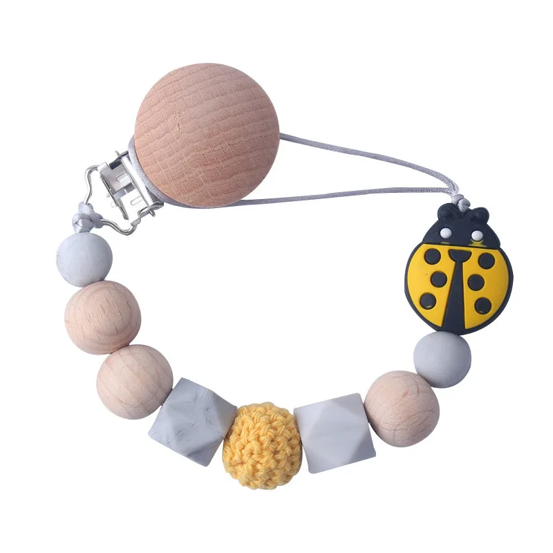 Wholesale Pink Insect Ladybug Beech Wood Infant Soft Silicone Wooden Soother Round Silicone Baby Dummy Clip Pacifier Clip