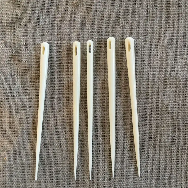 natural and historical bone needles with engraving design from viking age for using in knitting