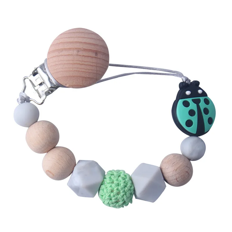 Wholesale Pink Insect Ladybug Beech Wood Infant Soft Silicone Wooden Soother Round Silicone Baby Dummy Clip Pacifier Clip