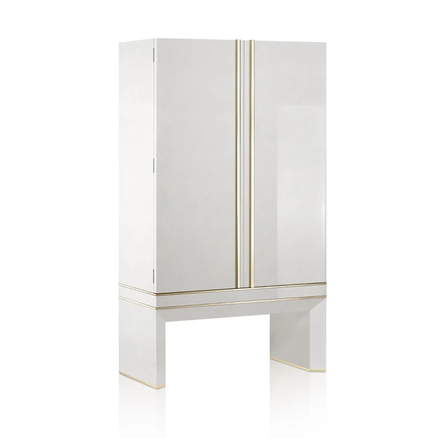 Armoured jewelry armoire in polished white birds eye maple and 24 karats gold hardware. Biometric opening device safe