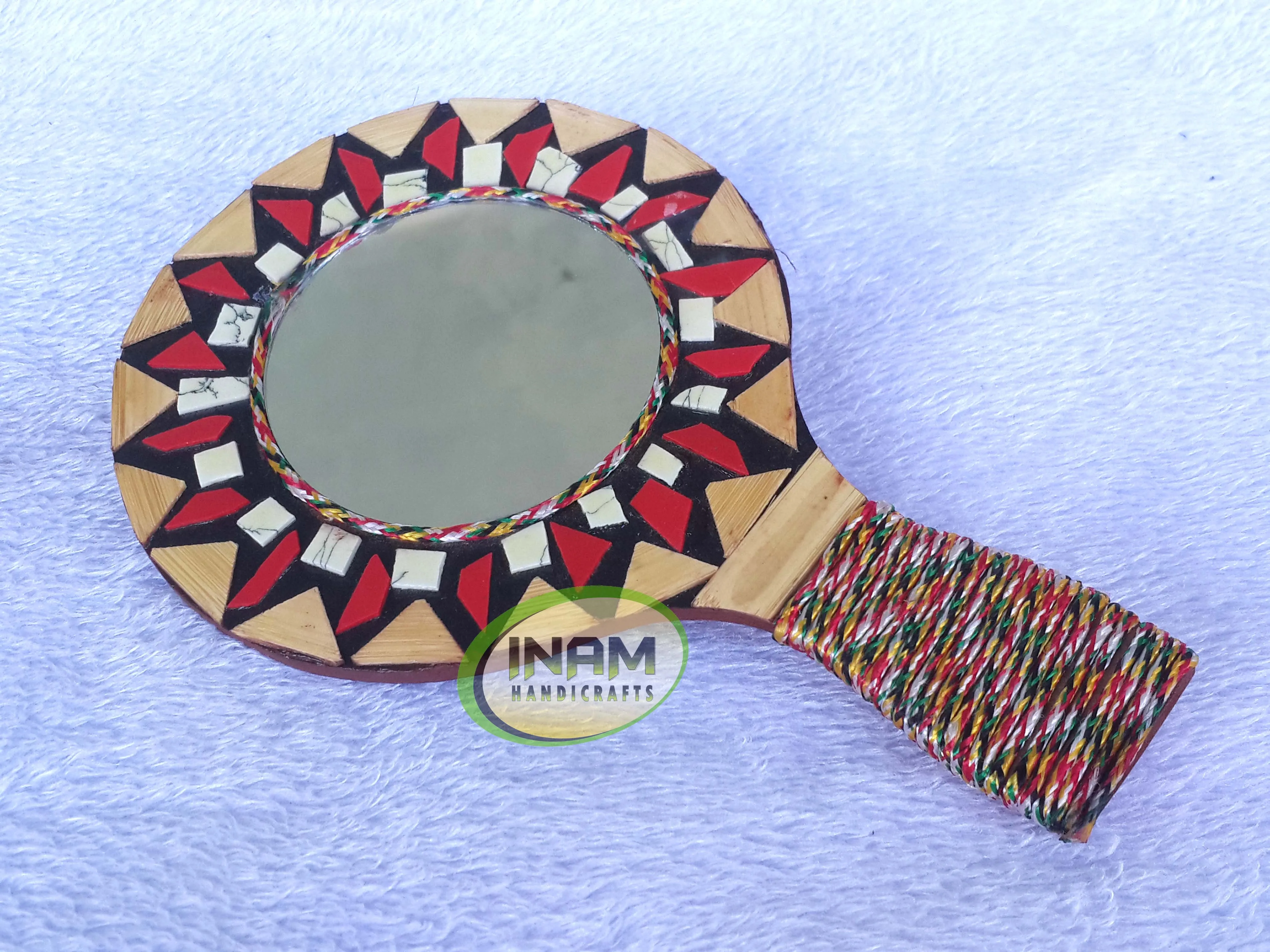 Modern hand held mirror for shaving , makeup etc.