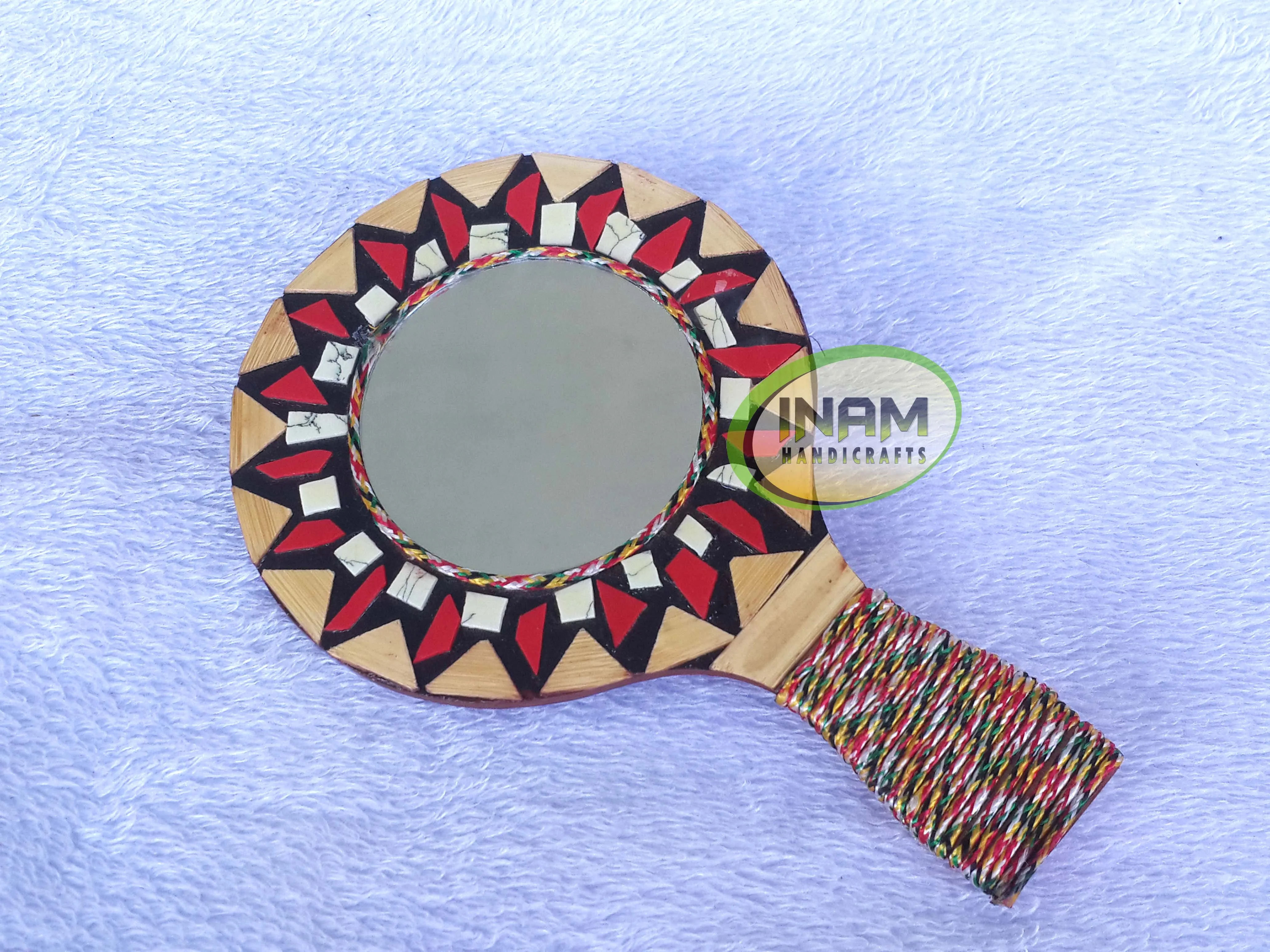 Modern hand held mirror for shaving , makeup etc.