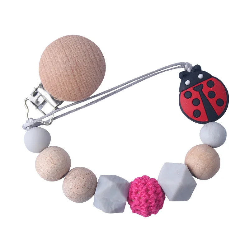Wholesale Pink Insect Ladybug Beech Wood Infant Soft Silicone Wooden Soother Round Silicone Baby Dummy Clip Pacifier Clip