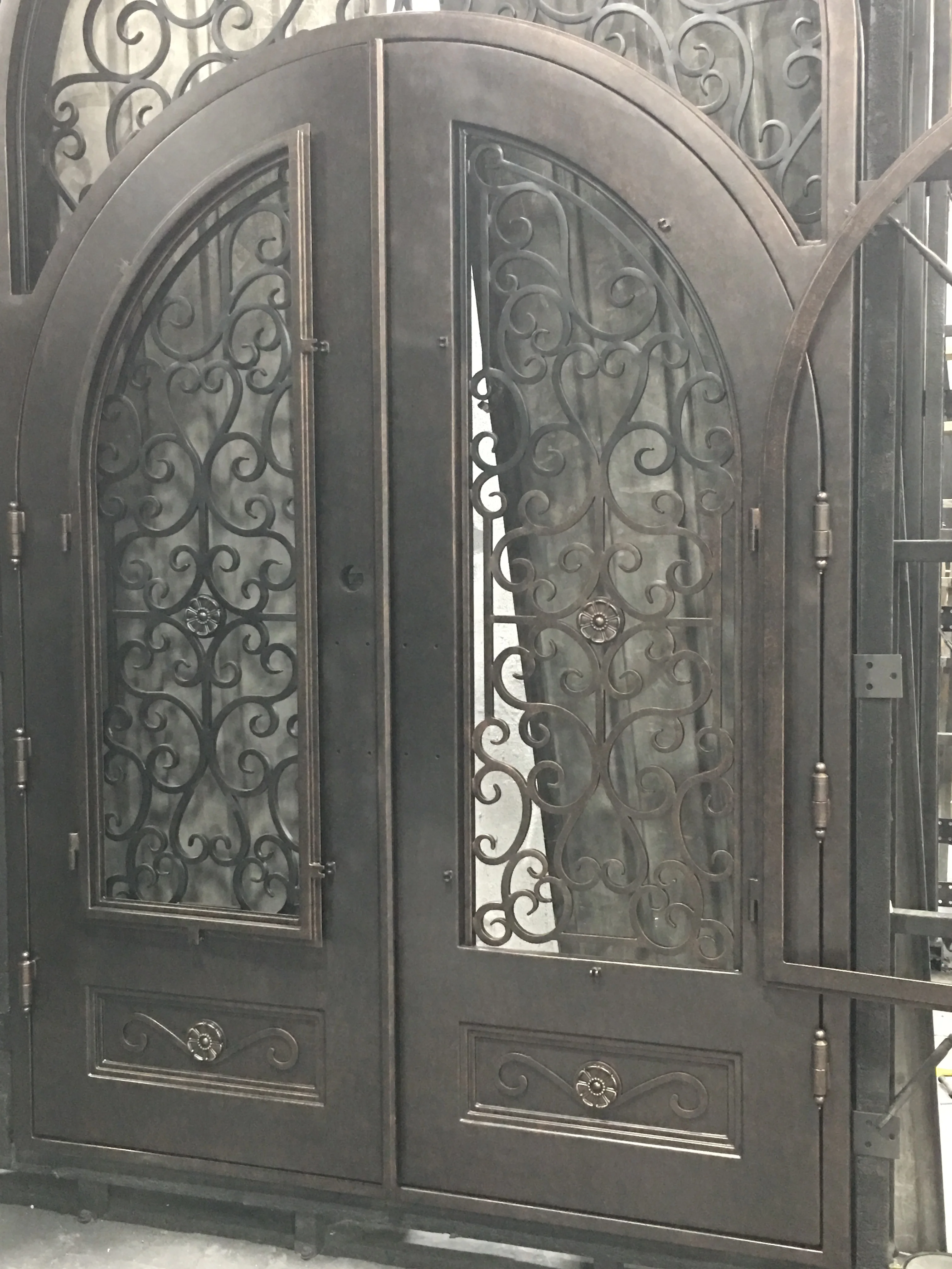 arched double wrought single iron entry doors