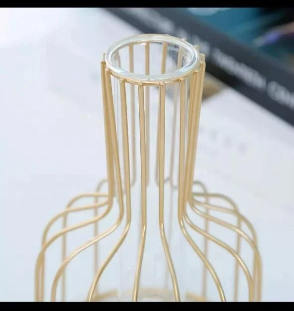 Decorative Vase In Golden Color With Glass Inside .