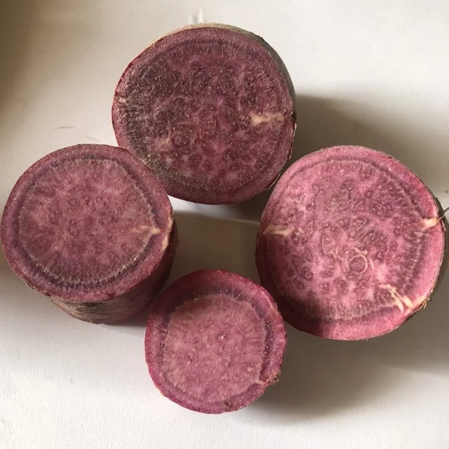 Yellow, purple and red sweet potato pieces to frozen and fried as customized