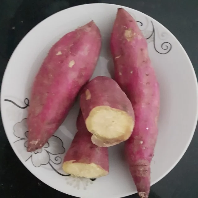 Yellow, purple and red sweet potato pieces to frozen and fried as customized