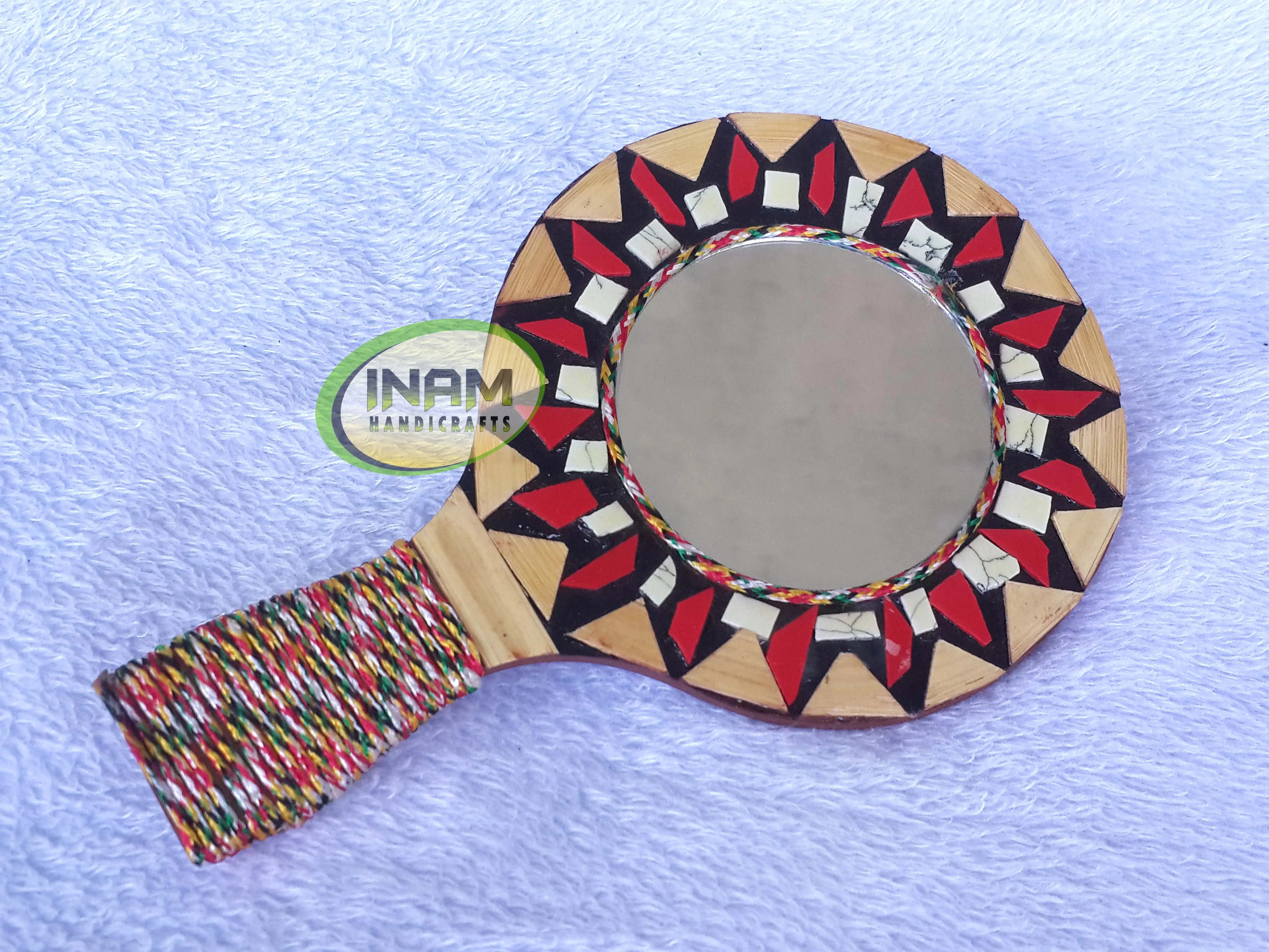Modern hand held mirror for shaving , makeup etc.